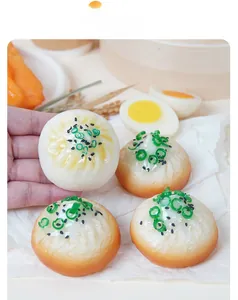 Macro shot of realistic PVC dumpling keychain with spring onion and sesame toppings