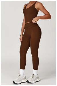 Close-up of cross-back yoga vest and high-waist leggings in deep coffee brown set