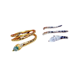 Snake wrap ring with pear-cut gemstones and textured scales in gold and silver finish