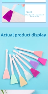 Detail view of colorful silicone face mask brushes with flat applicator heads and white handles