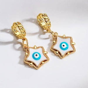 18K gold plated star hoop earrings with evil eye enamel charms on white background