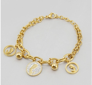 Detail view of 18K gold plated stainless steel bracelet with portrait charms and crystals