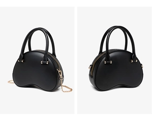 Detail of black PVC jelly bag showing glossy texture and elegant gold chain strap