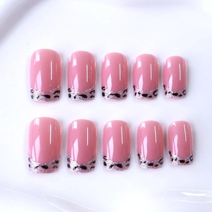 Pink leopard print press-on nails with silver glitter French tips in medium-long square shape