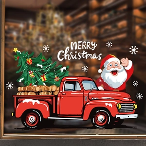 Christmas window stickers with red truck, Santa Claus, and tree on glass surface