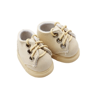 Detailed view of miniature beige lace-up fabric shoes for 15-20cm cotton dolls