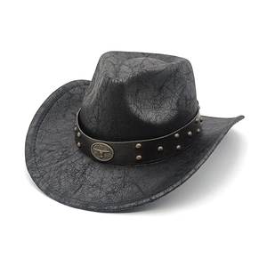 Chapeau de cowboy western noir vintage avec bande en cuir cloutée et boucle de taureau