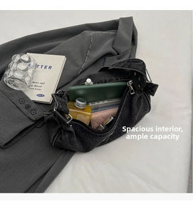 Macro view of spacious dark grey denim bag interior with high capacity and black zipper