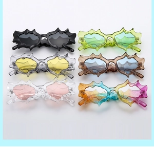 Detailed display of six colorful irregular futuristic sunglasses in varied resin shades