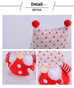 Detail of Christmas gnome with beige knitted heart hat and plush white beard decor