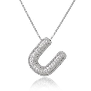 Close-up of silver letter U pendant with micro-pave cubic zirconia on box chain