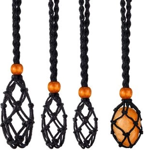 Detail of hand-woven black cord necklaces featuring natural wood beads and amber stones