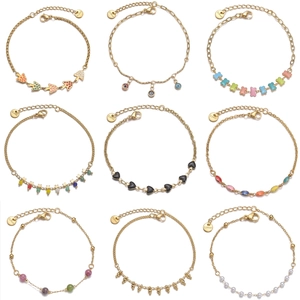 Collection of nine 14K gold plated stainless steel bracelets with various fashion charms