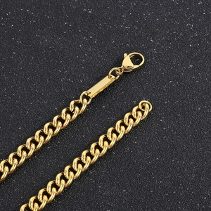 Close-up of golden stainless steel Cuban chain necklace with a secure lobster clasp