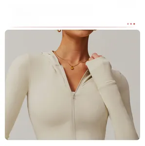 Detail of apricot zip-up sports jacket featuring smooth texture and durable zipper