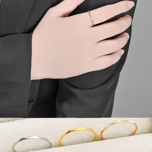 Detailed view of 1mm faceted thin rings in silver, gold, and rose gold finishes