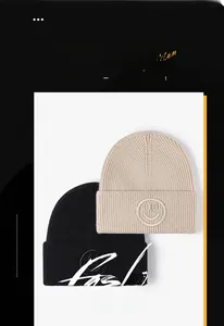 Close-up of winter beanie hats featuring 3D smiley face embroidery and knit texture