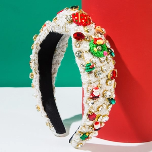White tweed Christmas headband with pearls, rhinestones and festive charms on red background