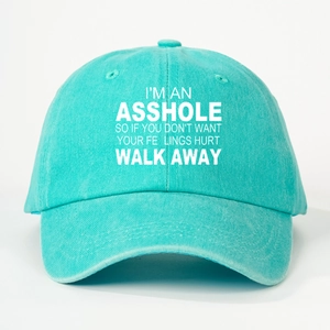Close-up of embroidered text on the blue washed cotton baseball cap fabric texture