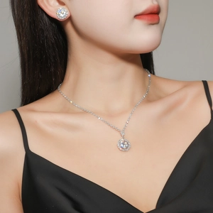 Elegant halo zircon jewelry set featuring round cut crystal necklace and earrings for brides