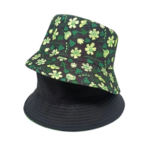 Detailed view of reversible bucket hat showing floral print and plain black side