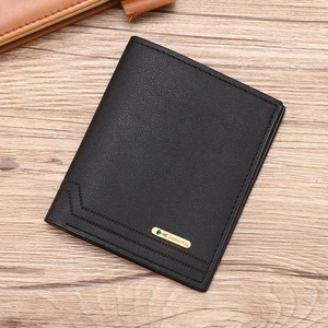 Slim men's black leather wallet with metal logo on a wooden surface, stylish and functional
