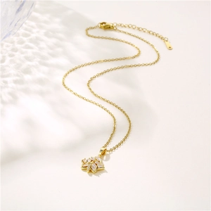 Hip hop maple leaf necklace with sparkling zircons on a wavy light background