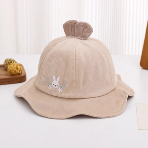 Close-up of khaki corduroy baby sun hat with cute 3D bunny ears and floral embroidery