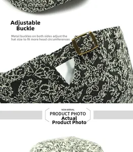 Detail of metal buckle adjustment on paisley pattern vintage newsboy cap fabric