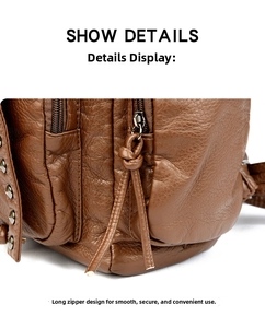 Detail of brown faux leather backpack featuring long knotted zipper pulls and metal rivets