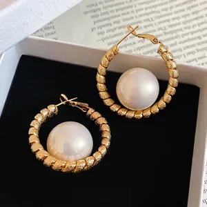 Elegant gold-plated twisted hoop earrings with large lustrous white pearls for women