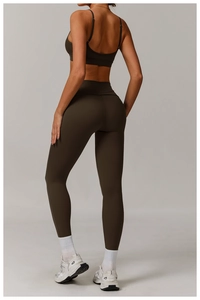Rear view of brown high-waisted yoga leggings and sports bra with seamless stitching