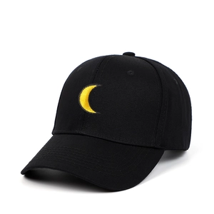 Classic black baseball cap with yellow crescent moon embroidery on a plain white background