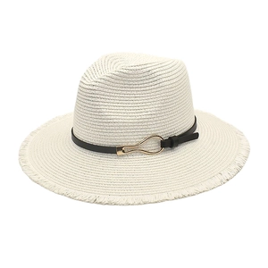 Close-up of summer straw sun hat with black leather band and gold metal buckle detail