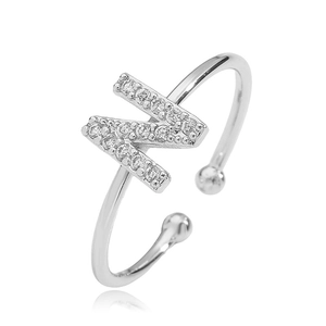 Close-up of silver-tone open ring featuring a sparkling cubic zirconia letter M design