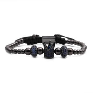 Detail of black crown bracelet with micro-set blue zircon beads on polished metal