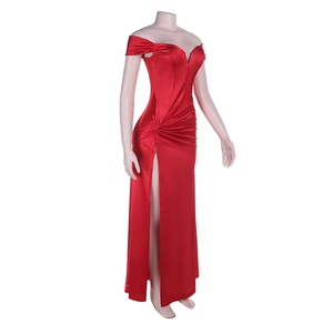 Close-up of red off-shoulder satin gown featuring ruched waist and high split detail