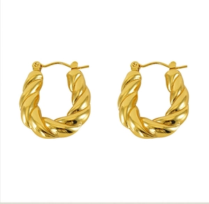 Detailed close-up of 18k gold plated twisted rope hoop earrings on white background