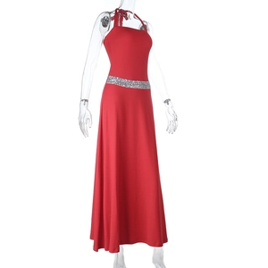 Detailed view of silver sequin waist belt on a red halter-neck evening maxi dress