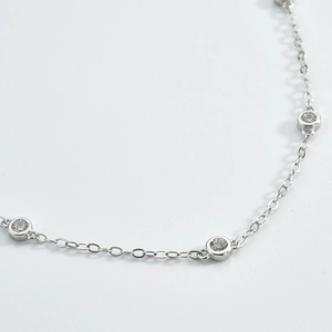 Close-up of S925 sterling silver bracelet with shimmering round diamond-set links