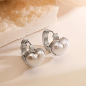Elegant heart-shaped pearl earrings in stainless steel hoops with minimalist design