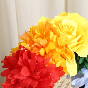 Detailed close-up of colorful silk rose and dahlia petals with delicate pearl accents