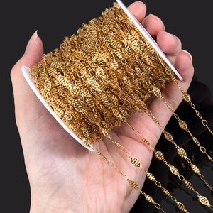 Gold plated stainless steel leaf chain on white spool for DIY jewelry making