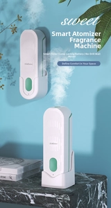 Close-up of smart wall-mounted fragrance diffuser showing timing and battery life features