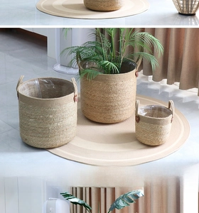 Set of three natural woven grass flower baskets with handles and waterproof liners