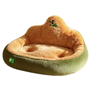 Green corduroy pet bed with thick brown plush interior and mountain embroidery