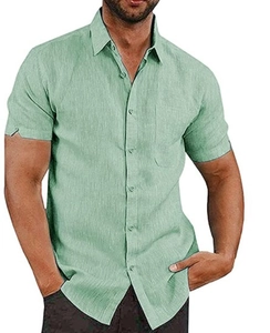 Detail of sage green linen shirt featuring lapel collar and chest pocket texture