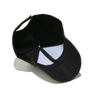 Detailed interior view of leopard print baseball cap with adjustable strap and lining