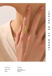 Close-up of golden snake ring in 18K gold plated stainless steel on finger