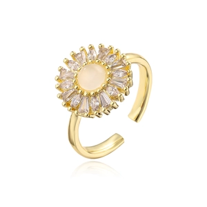 Detail of 18K gold plated sunflower ring with zircon micro-paving and cream gemstone